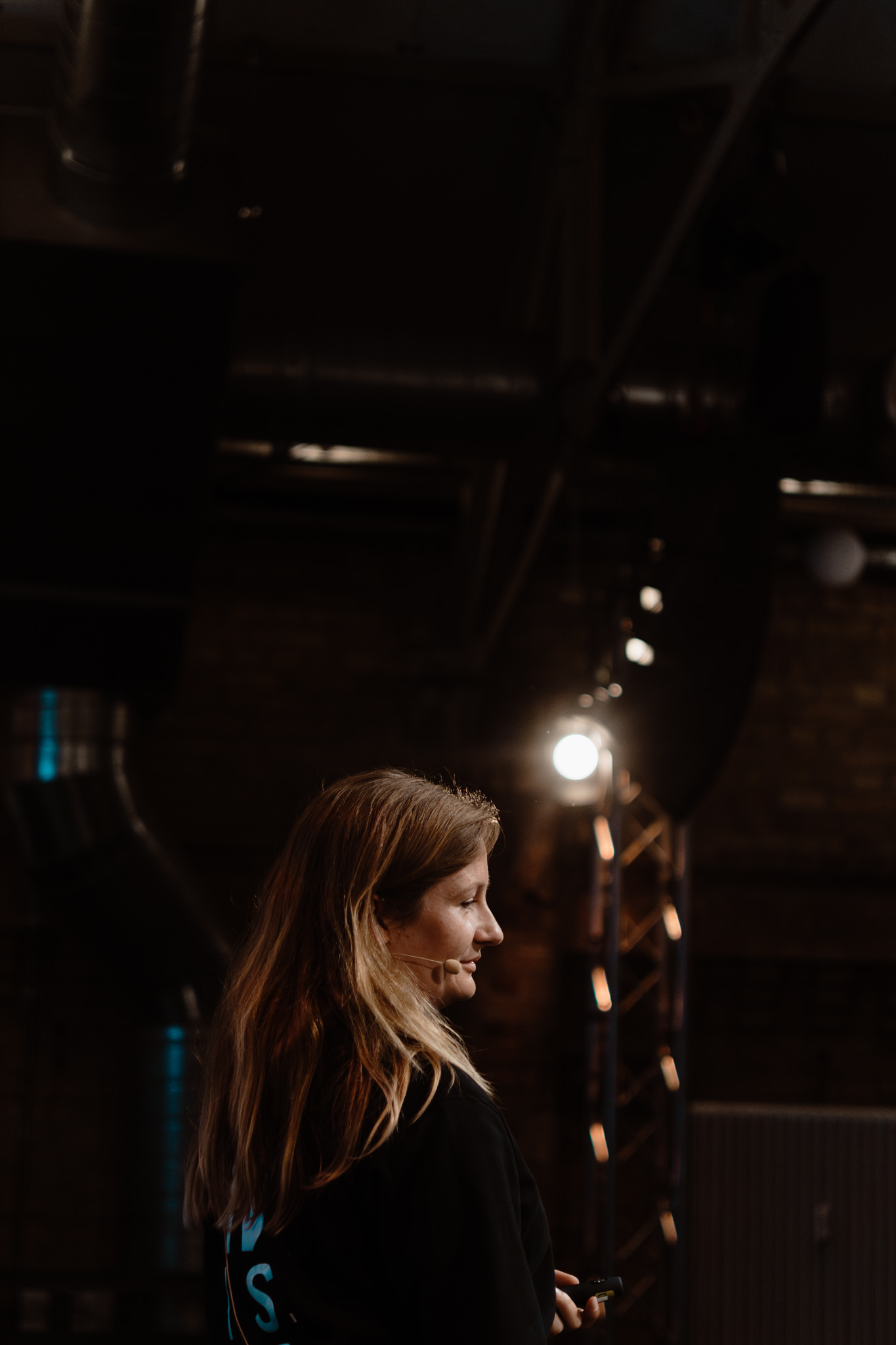 Attendee in profile in the warm light between sessions