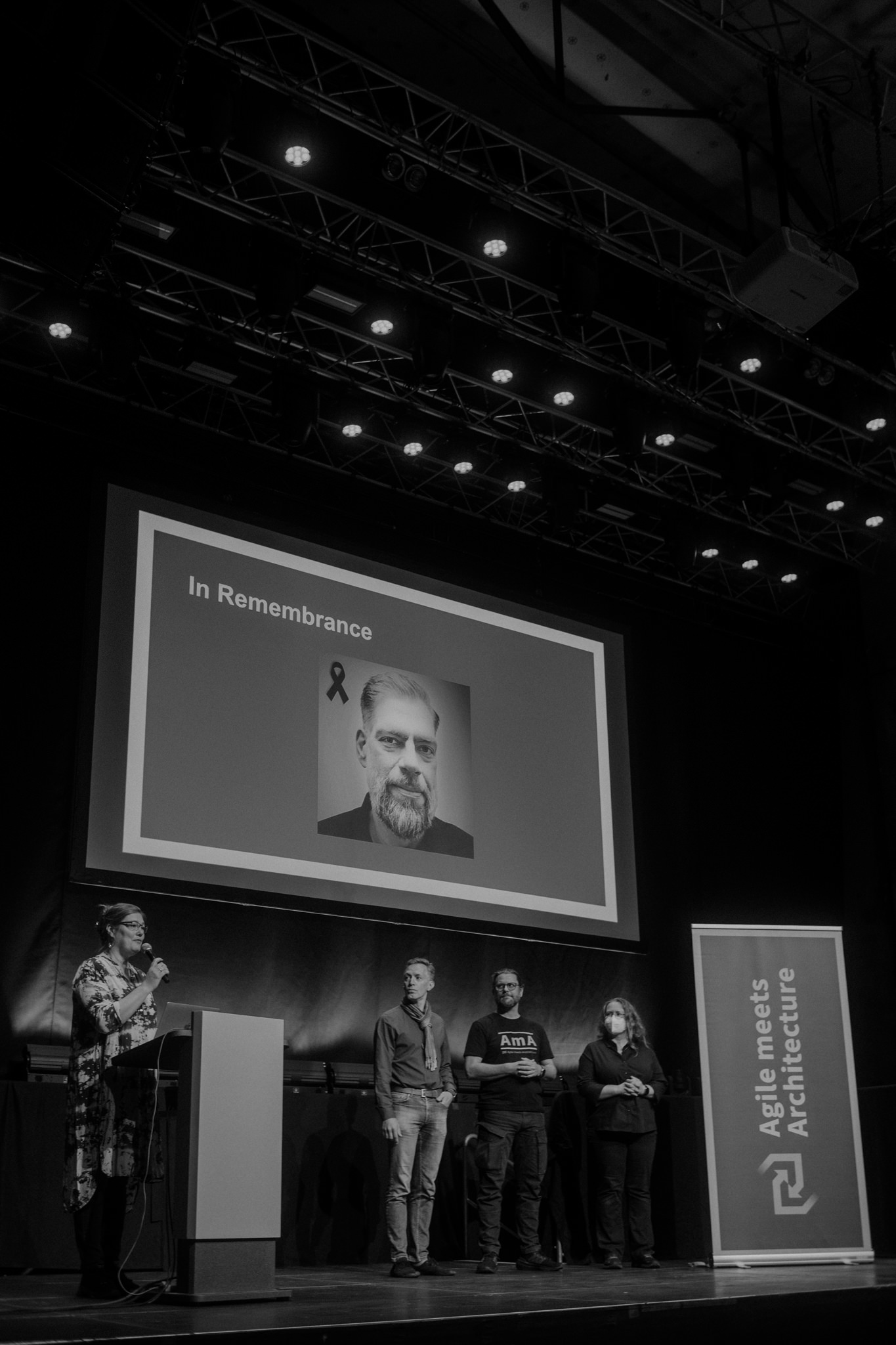 A remembrance moment on the main stage, in black and white