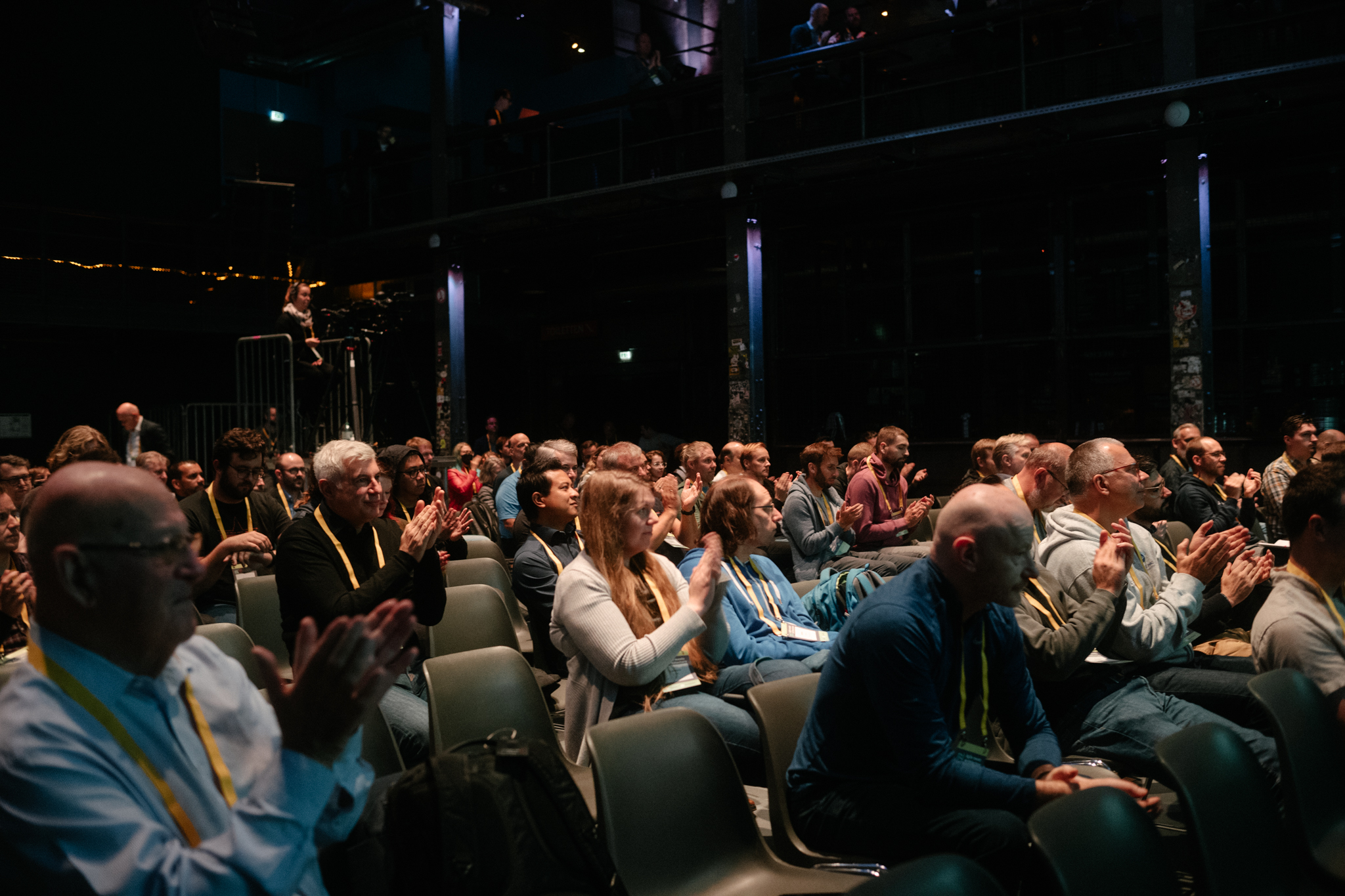 Audience applauding after a session